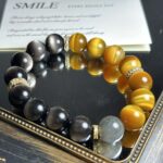 Artistic Composition with Bracelet, Seashells and Water Mist