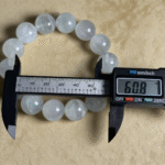 Dynamic Shot of Fluorite Bracelet in Water Light Reflections