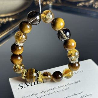 Close-up of a natural citrine bracelet with golden yellow crystals, set against an earthy background to highlight the earth element in Five Elements philosophy.