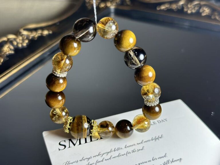 Close-up of a natural citrine bracelet with golden yellow crystals, set against an earthy background to highlight the earth element in Five Elements philosophy.