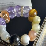 Creative Composition with Yellow Phantom Bracelet and Four Element Symbols