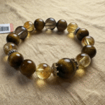 Smoky quartz bracelet paired with complementary crystals on a flowing water-themed display, illustrating harmony in the water element.