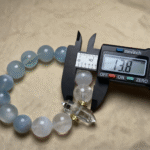 Winter Scene Composition with Bracelet, Ice Crystals and Snowflakes