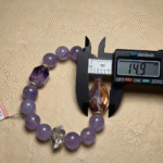 Amethyst and Herkimer diamond bracelets paired together, demonstrating fire-metal element harmony