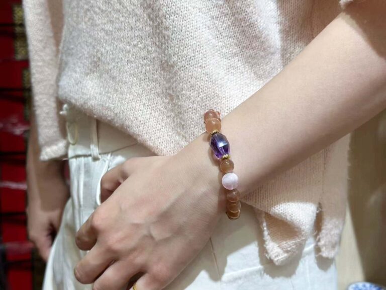 Herkimer diamond bracelet with transparent quartz points, arranged on geometric metal surface