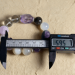 Labradorite bracelet showing dramatic color play, capturing blue flashes in dynamic movement