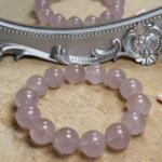 Rose quartz bracelet layered with complementary clear quartz and moonstone bracelets for stylish energy stacking